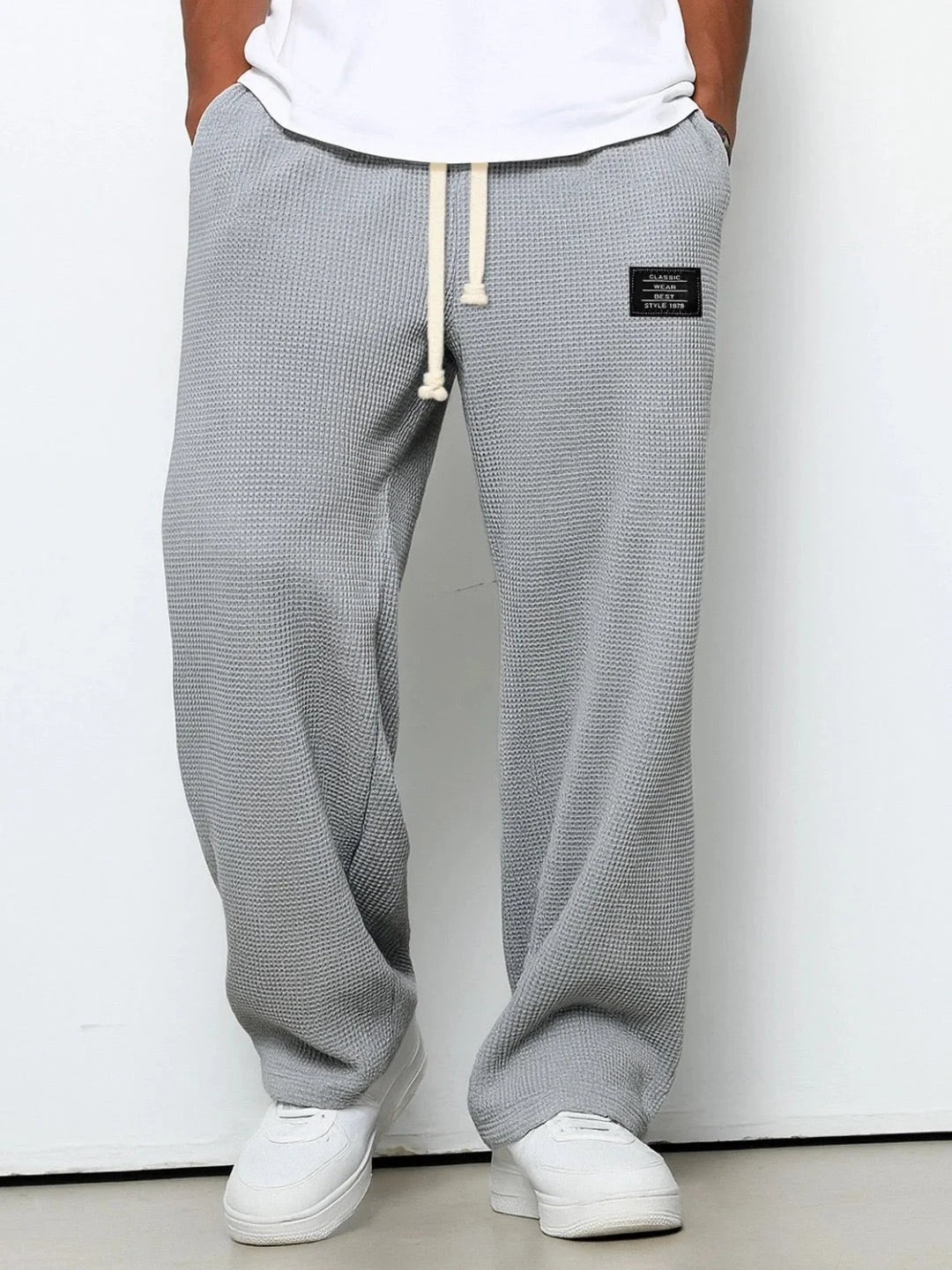 Pantaloni larghi testurizzati con cordoncino – Grigio
